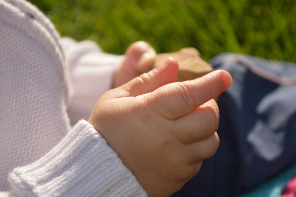 Hand person play leg Photo