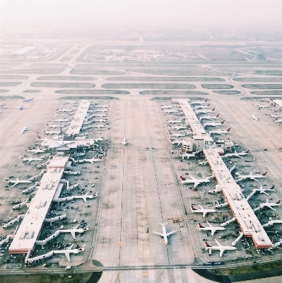 Cloudy skyscraper airport airplane Photo