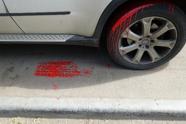 Car wheel sidewalk red Photo