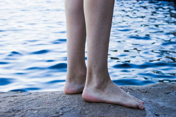 Foto Tangan laut pasir kaki