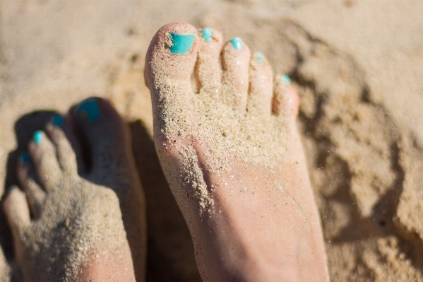 Hand beach sand shoe Photo