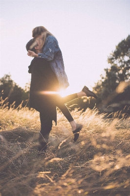 Man walking girl sunset Photo