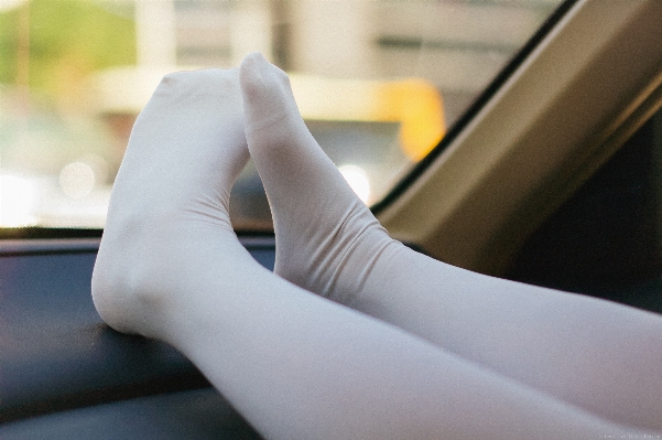 Hand girl white car Photo