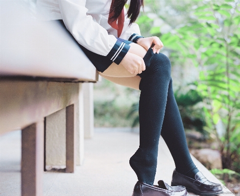 Foto Sepatu musim dingin bokeh
 gadis