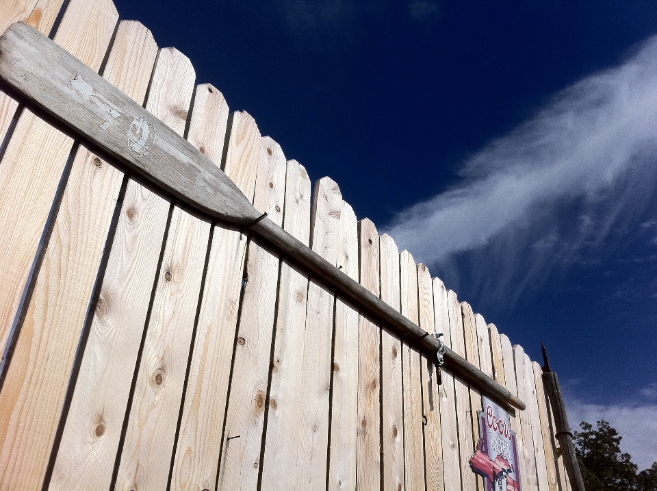 Fence sky wood roof