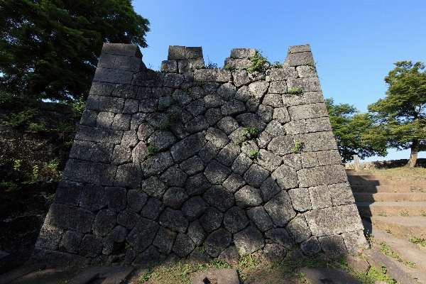 Rock building wall high Photo