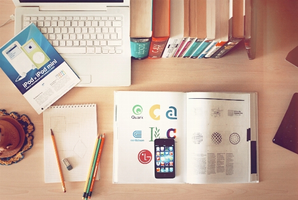 Laptop desk book pencil Photo