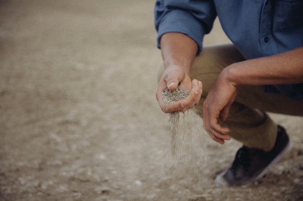 Hand man sand leg Photo