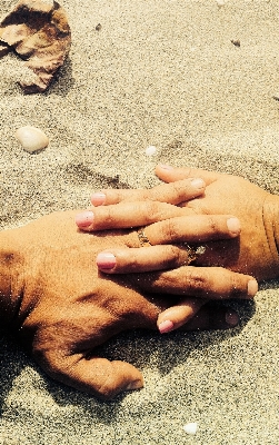 Hand sand leg love Photo