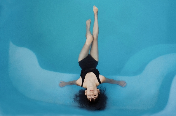 Woman diving pool underwater Photo