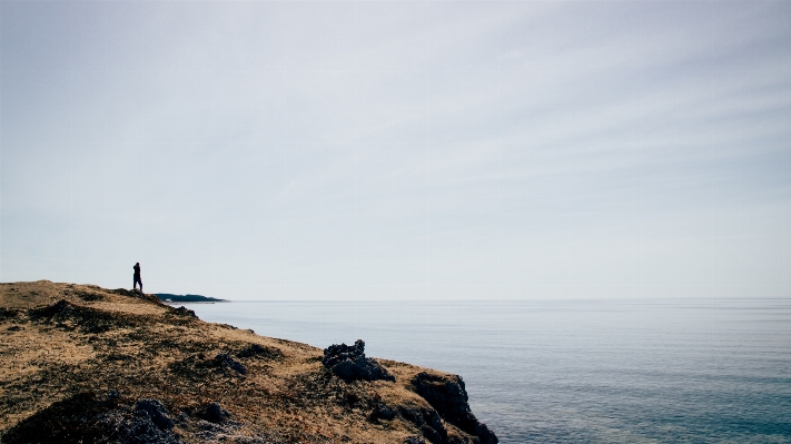 Man beach sea coast Photo