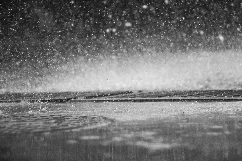 Sea water black and white rain