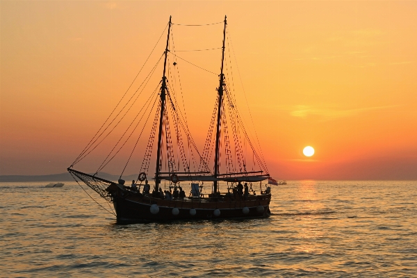 Sea ocean sunset boat Photo