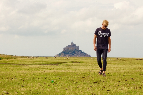 Man grass horizon walking Photo