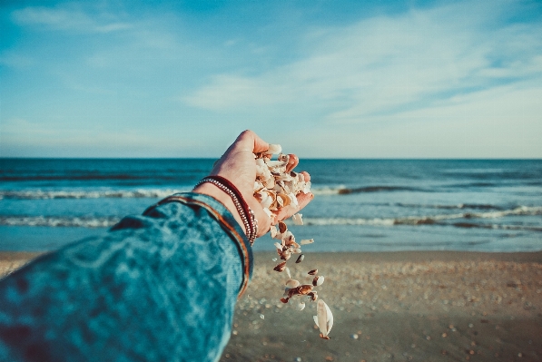 Hand beach sea water Photo