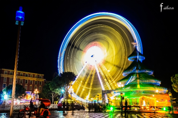 Light night cityscape ferris wheel Photo