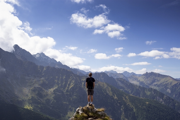 Man walking mountain cloud Photo