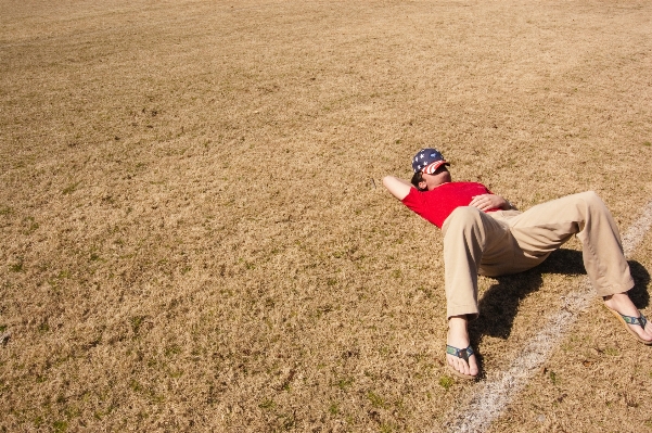 Man grass sand person Photo