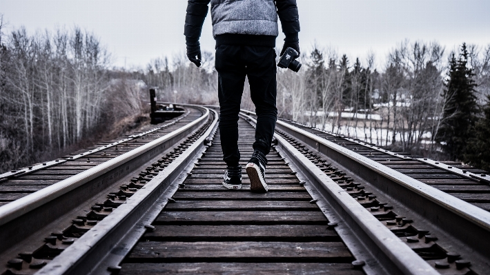 Person black and white track railway Photo