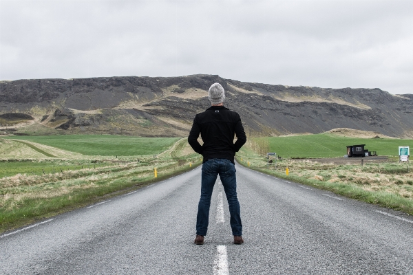 Man walking mountain cloud Photo