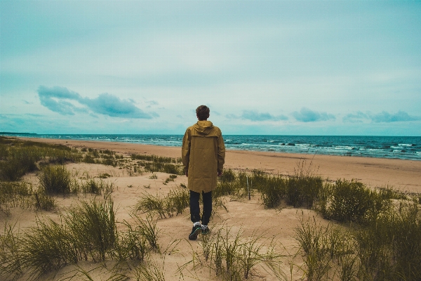 Man beach sea coast Photo