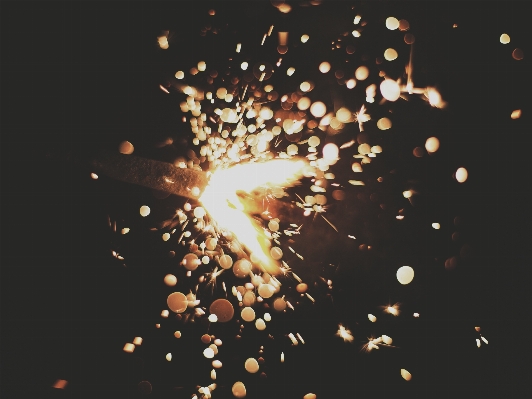 Bokeh dark sparkler spark Photo