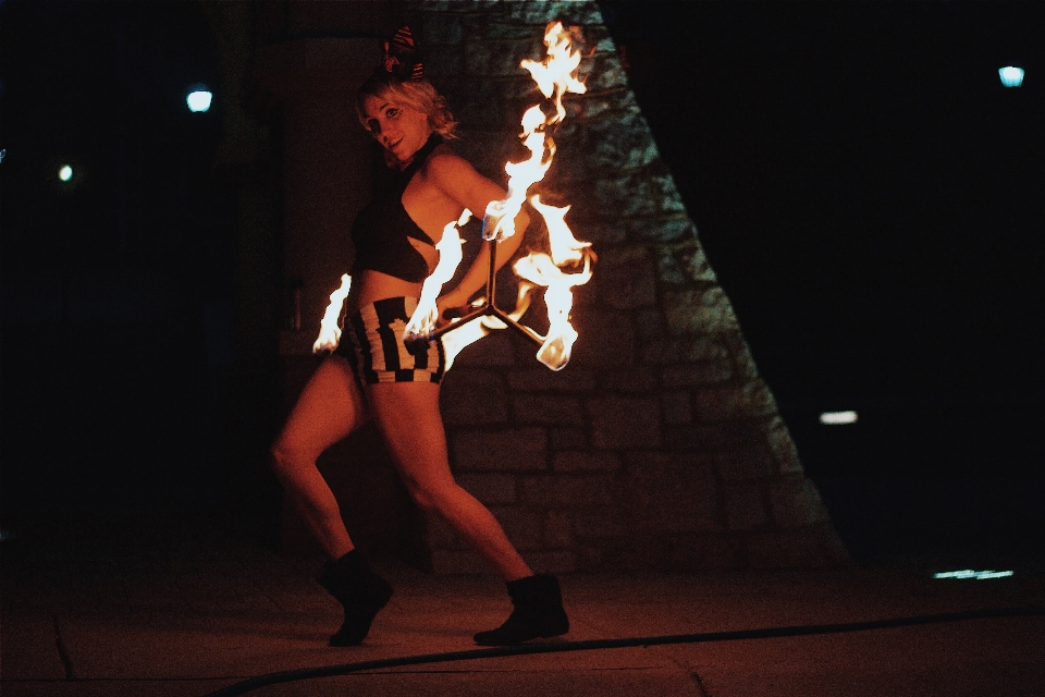 Woman dark dance fire