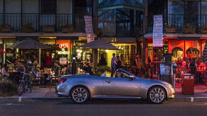 Car night sidewalk city Photo