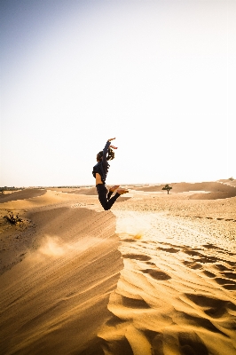 Landscape sand silhouette girl Photo