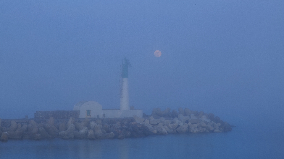 Sea water lighthouse fog