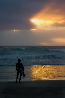 Man beach sea coast Photo