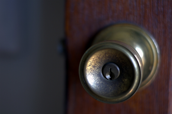 Close up wooden door eye lock Photo