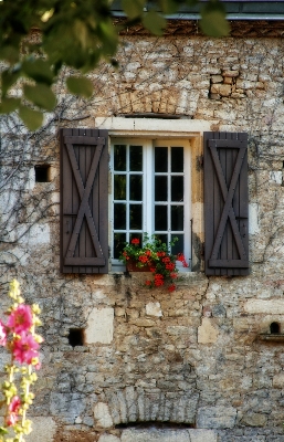 Wood house flower window Photo