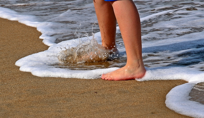 Hand beach sea water Photo