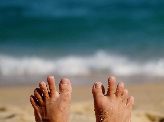 Hand beach sea outdoor Photo