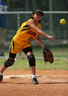 Fence girl baseball glove Photo