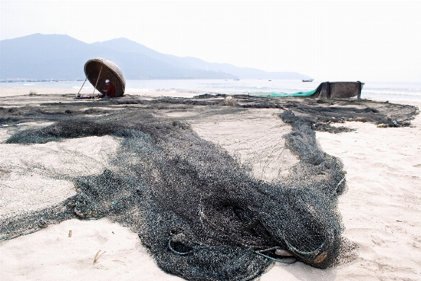 Coast sand rope sky Photo