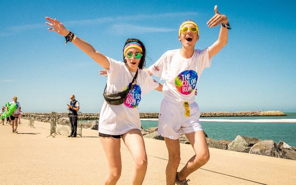 Beach sea people running