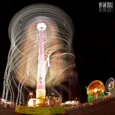 Light night ad ferris wheel Photo