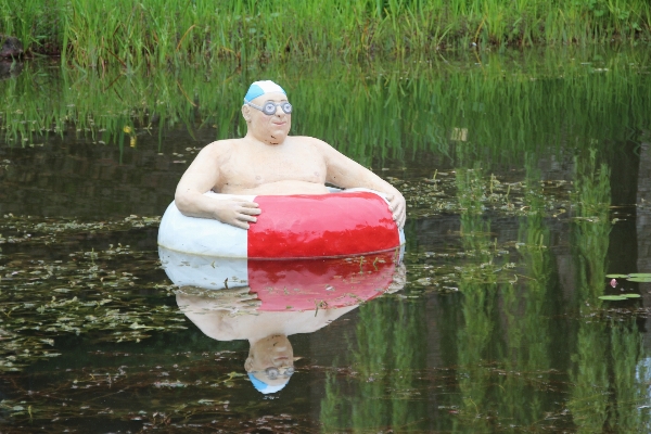 Foto Homem água barco nadar