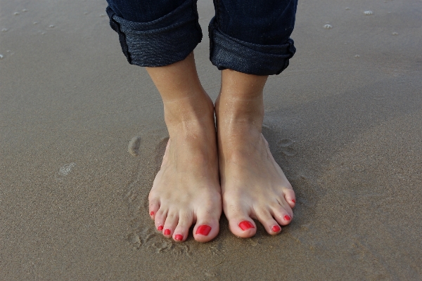 Hand beach sea water Photo