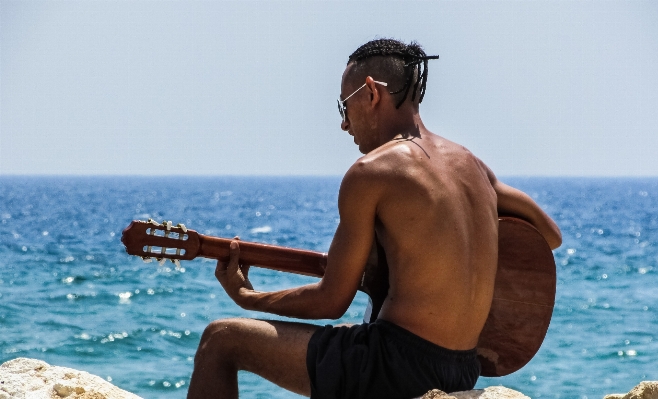 Man beach sea coast Photo