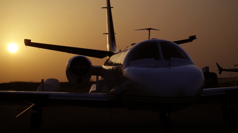 Silhouette sunset airport airplane