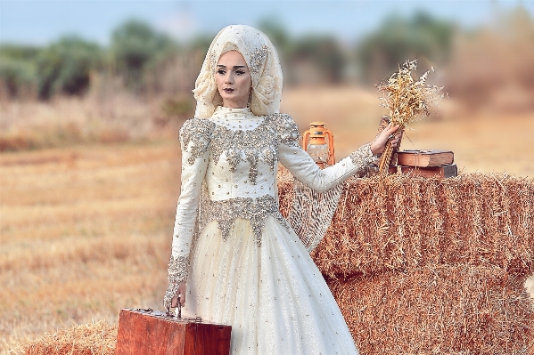 Book woman hay field Photo