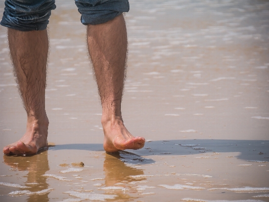 Man beach sea water Photo