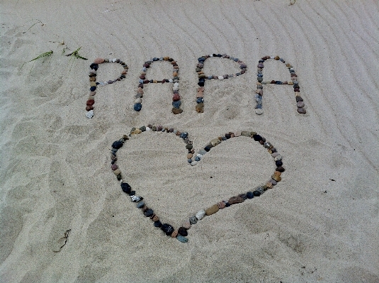 Beach sand heart symbol Photo