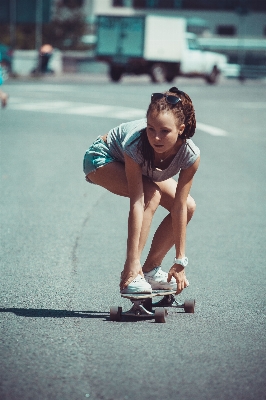 Girl woman hair skateboard Photo