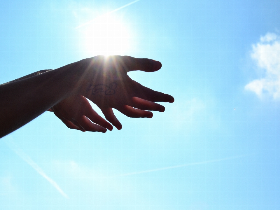 Hand silhouette wing cloud