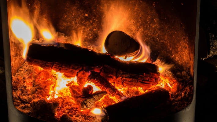 Glowing wood warm flame Photo