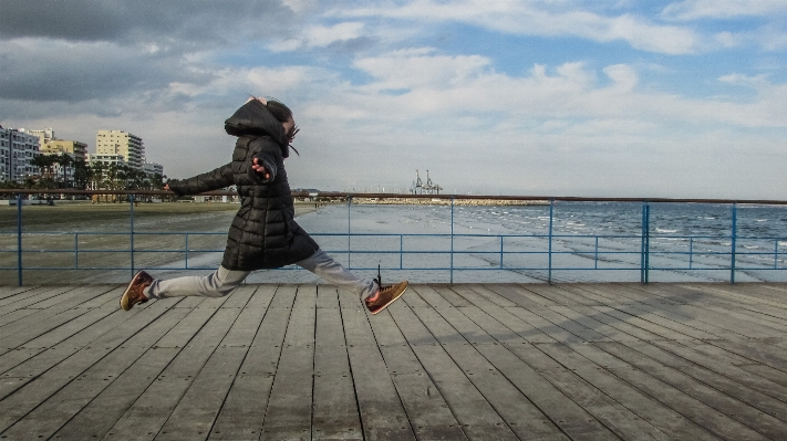 Sea deck boardwalk girl Photo